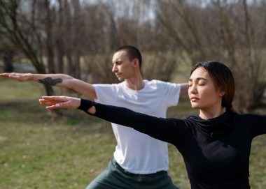 people-practicing-yoga-outside